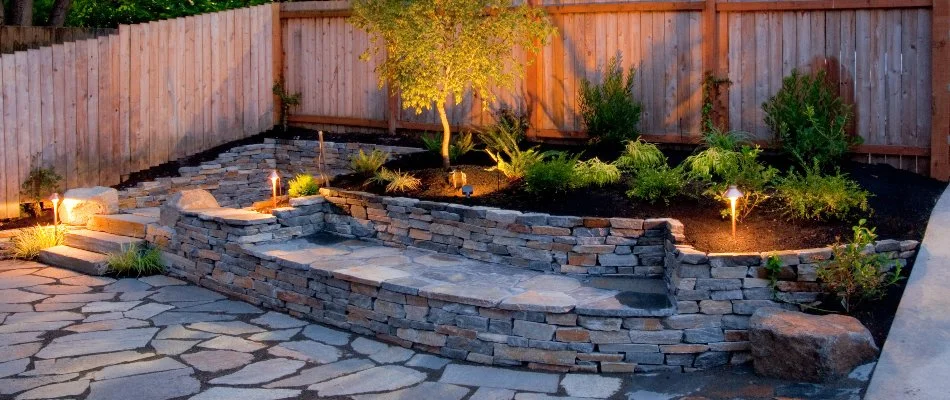 Compact landscape and outdoor steps in Saddle River, NJ, with outdoor lighting.