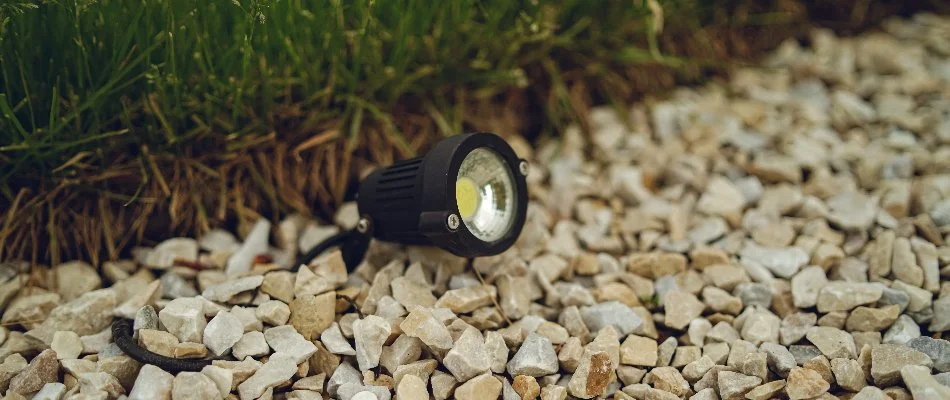 LED lighting fixture on landscaping rocks in Saddle River, NJ.