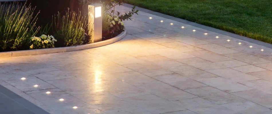 Patio in Saddle River, NJ, with outdoor lighting.