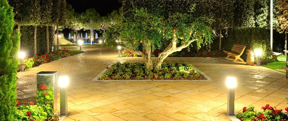 Outdoor lights and lush plants in a courtyard in Saddle River, NJ.