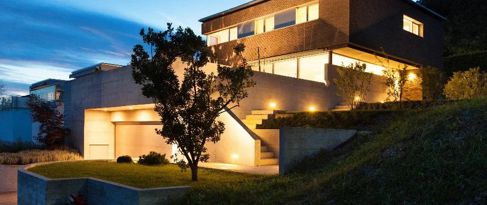 Exterior of a house in Old Bridge Township, NJ, with outdoor lighting.