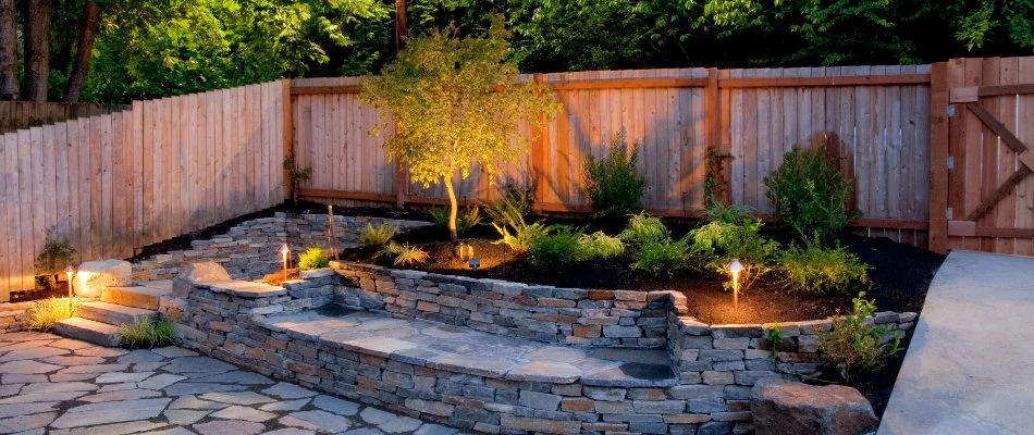 Landscape bed in Hamden, CT, with plants and outdoor lights.