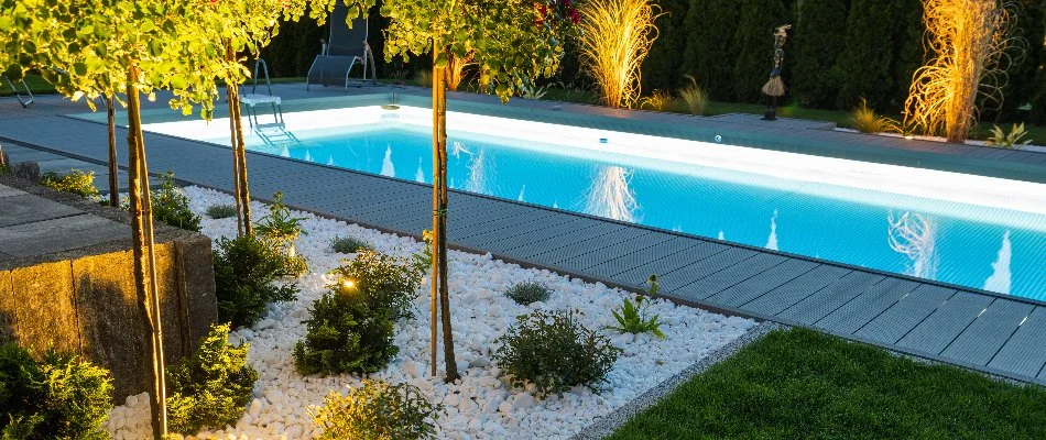 Lighting in landscape beds around a pool in Ridgewood, NJ.