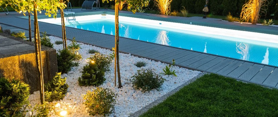 Outdoor lighting in a landscape around a pool in Hamilton Township, NJ.