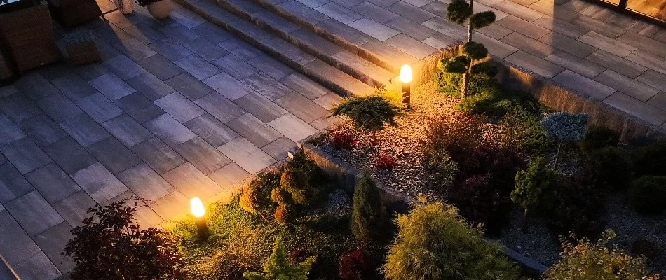 Outdoor lighting on landscape next to a patio in Mount Vernon, NY.