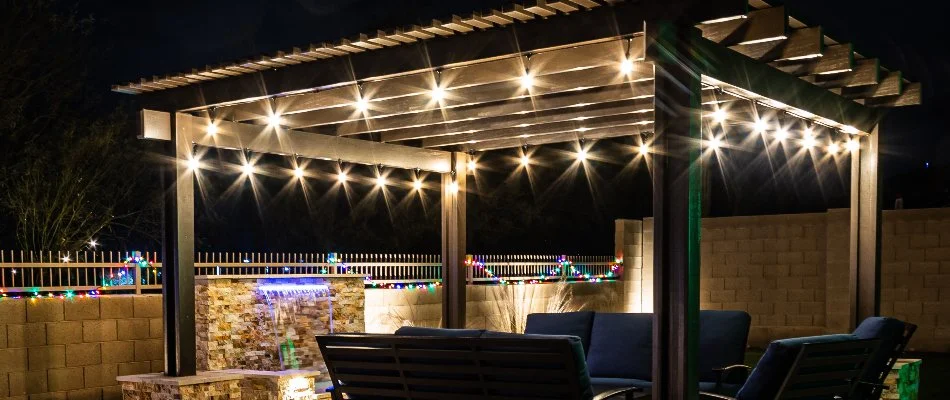 Pergola in Clifton, NJ, with outdoor lighting.