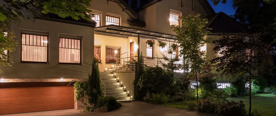 A property in Bergen County, NJ, illuminated with lights.